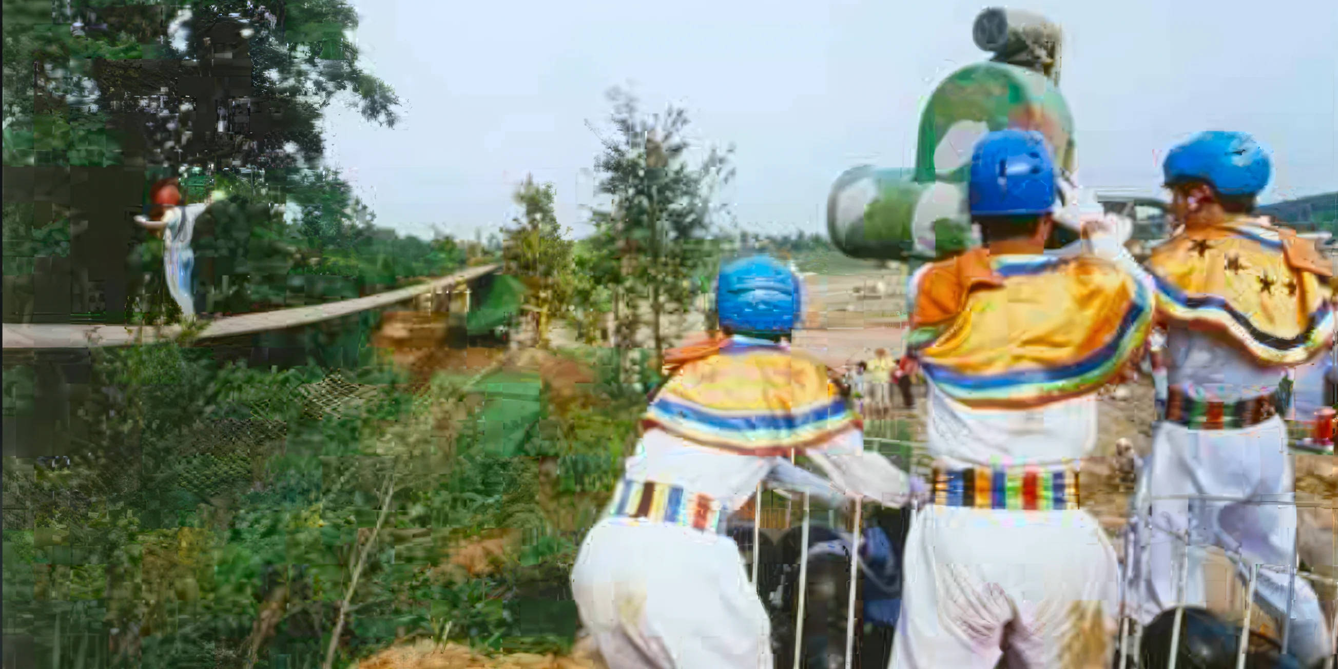 Three guards man a cannon as a contestant makes their way across a narrow bridge